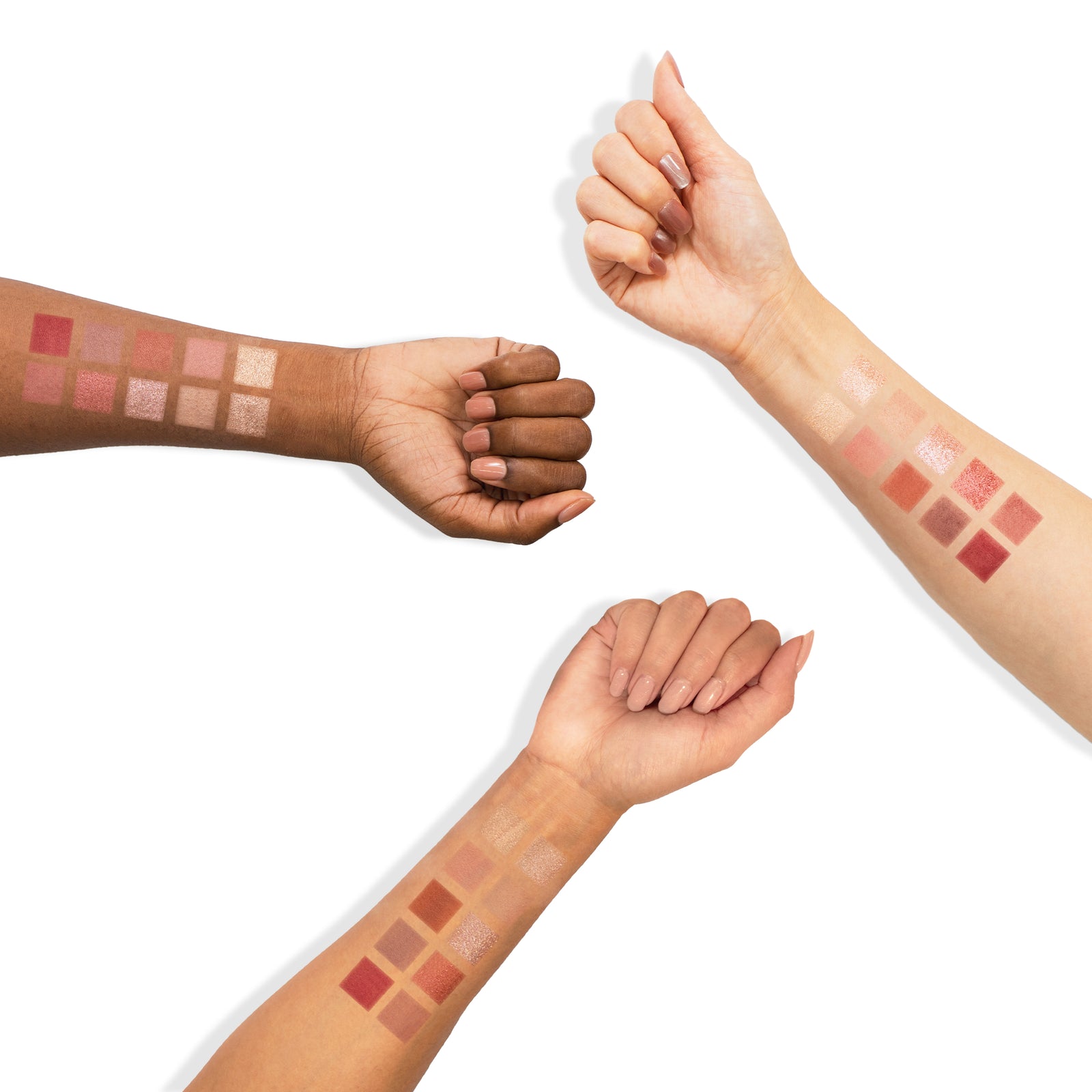Swatches of the Profusion Mauves Palette shown on three different skin tones, displaying rosy, nude, and mauve shades across each forearm.