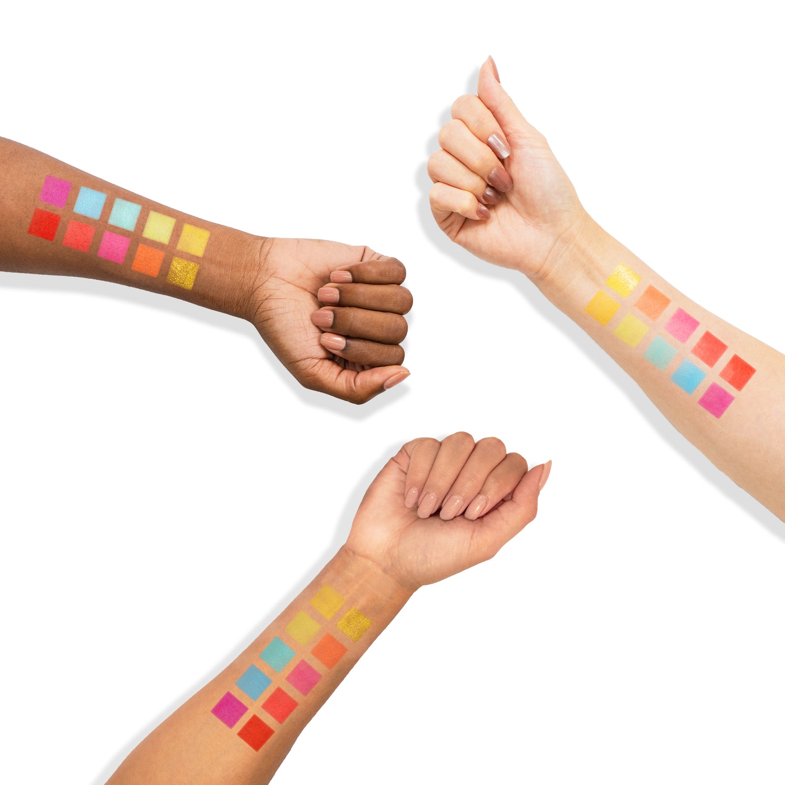 Swatches of the Profusion Neon Eyeshadow Palette shown on three different skin tones, featuring bold bright shades across each forearm.