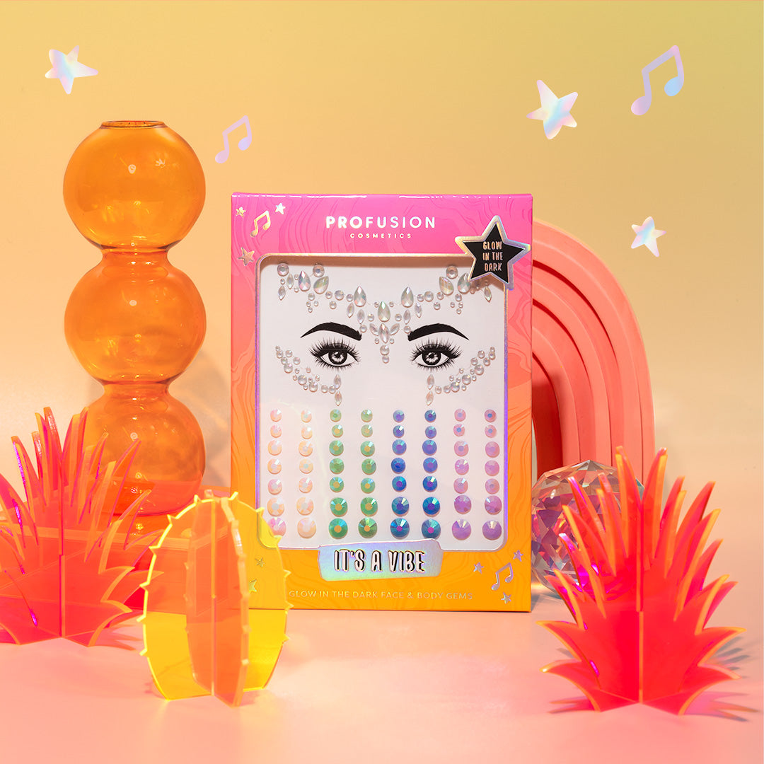 Profusion Cosmetics "It's A Vibe" face and body gems set, including colorful, glow-in-the-dark gems in various shapes and sizes.