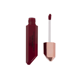 Liquid lipstick from Profusion Cosmetics' Liquid Vinyl collection in shade "Karma" with the applicator upright next to it.