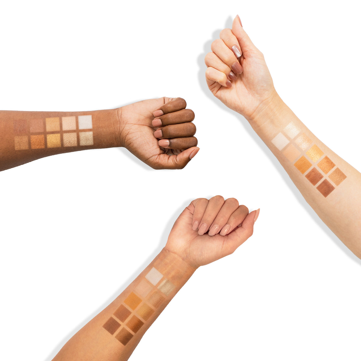 Swatches of the Profusion Nudes Eyeshadow Palette shown on three different skin tones, displaying neutral beige, brown, and gold shades across each forearm.