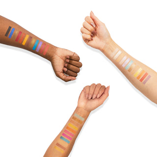 Profusion Cosmetics Festival Eyeshadow Palette arm swatches, showing vibrant blue, pink, gold, and orange shades.