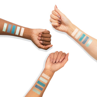 Matte and shimmer eyeshadow swatches in blue, teal, and white shades.
