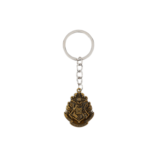 Keychain with a Hogwarts emblem on a white background
