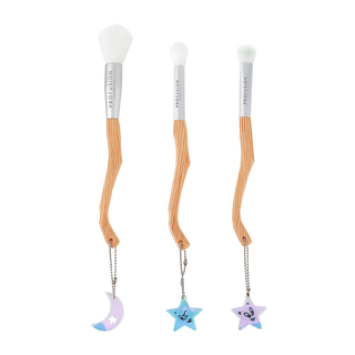 three piece broom shape makeup brush with charms at the end of each brush in shapes of the moon and two brushes with the shape of stars.