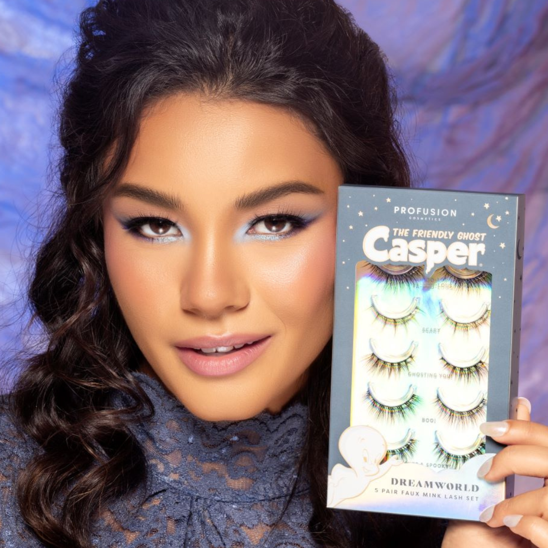 model holding a box of 5 sets of faux lashes
