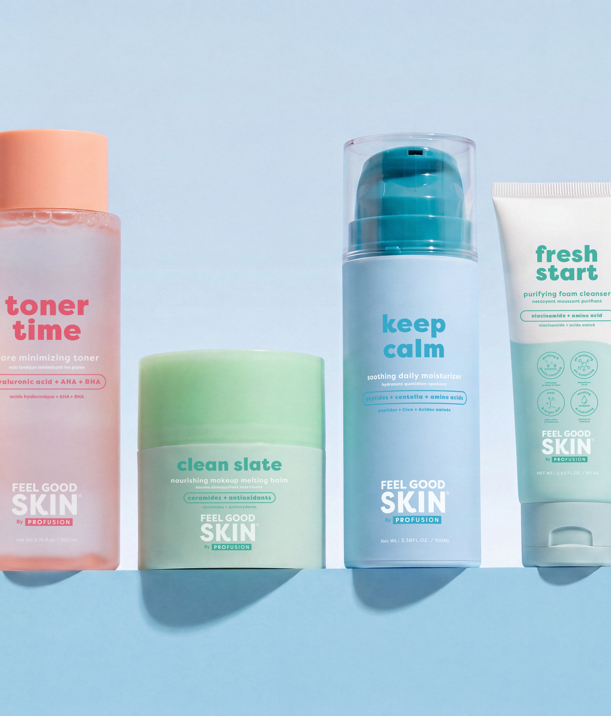 Four skincare products from Feel Good Skin lined up on a light blue background: a pink toner bottle, a mint green cleanser jar, a light blue serum pump bottle, and a white moisturizing tube.