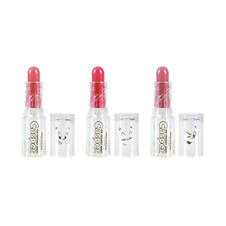 uncap three different shades of lip balm colors in red hues