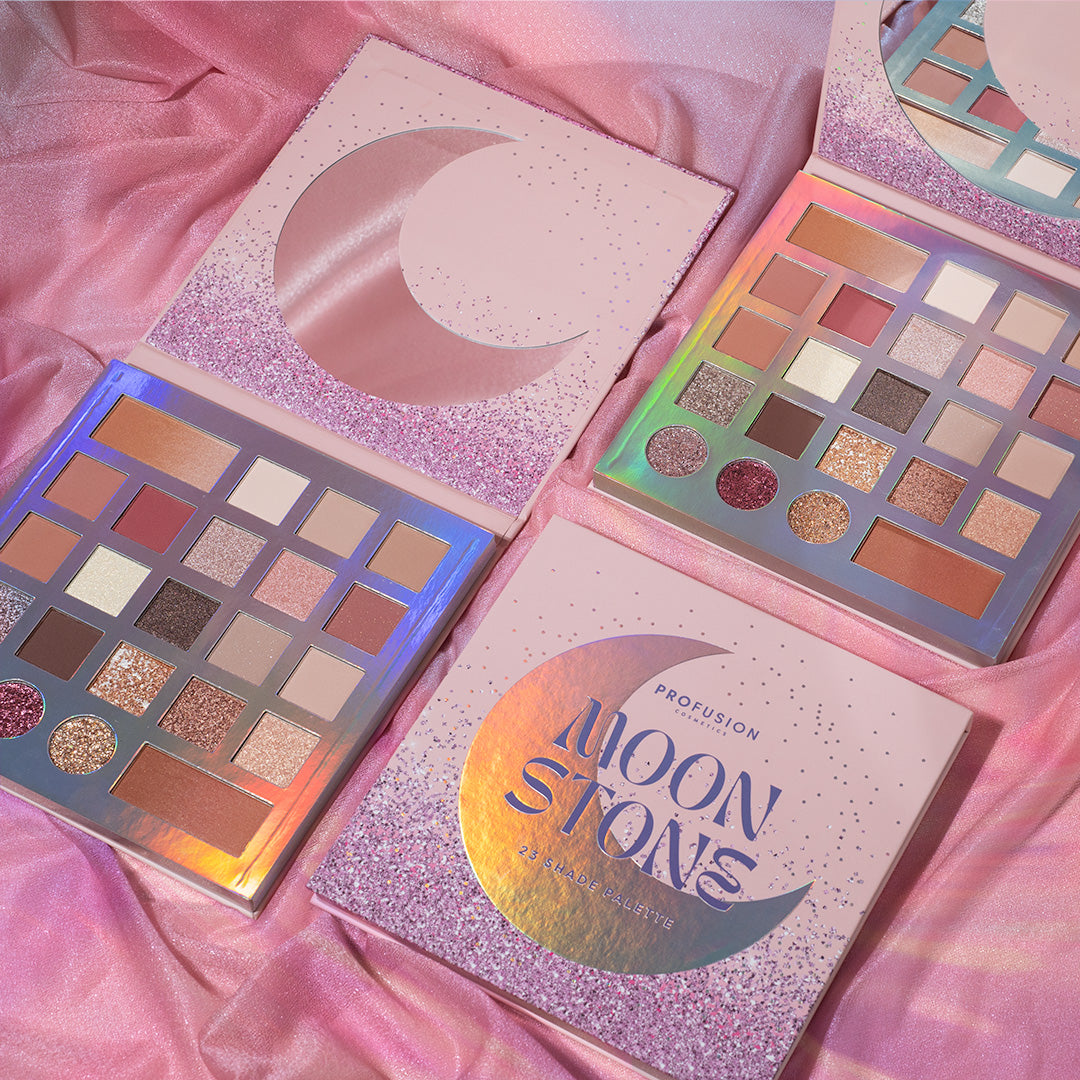 Profusion Cosmetics' "Moonstone" collection features eyeshadow palettes with a variety of shimmering and matte shades in pink, purple, and neutral tones.
