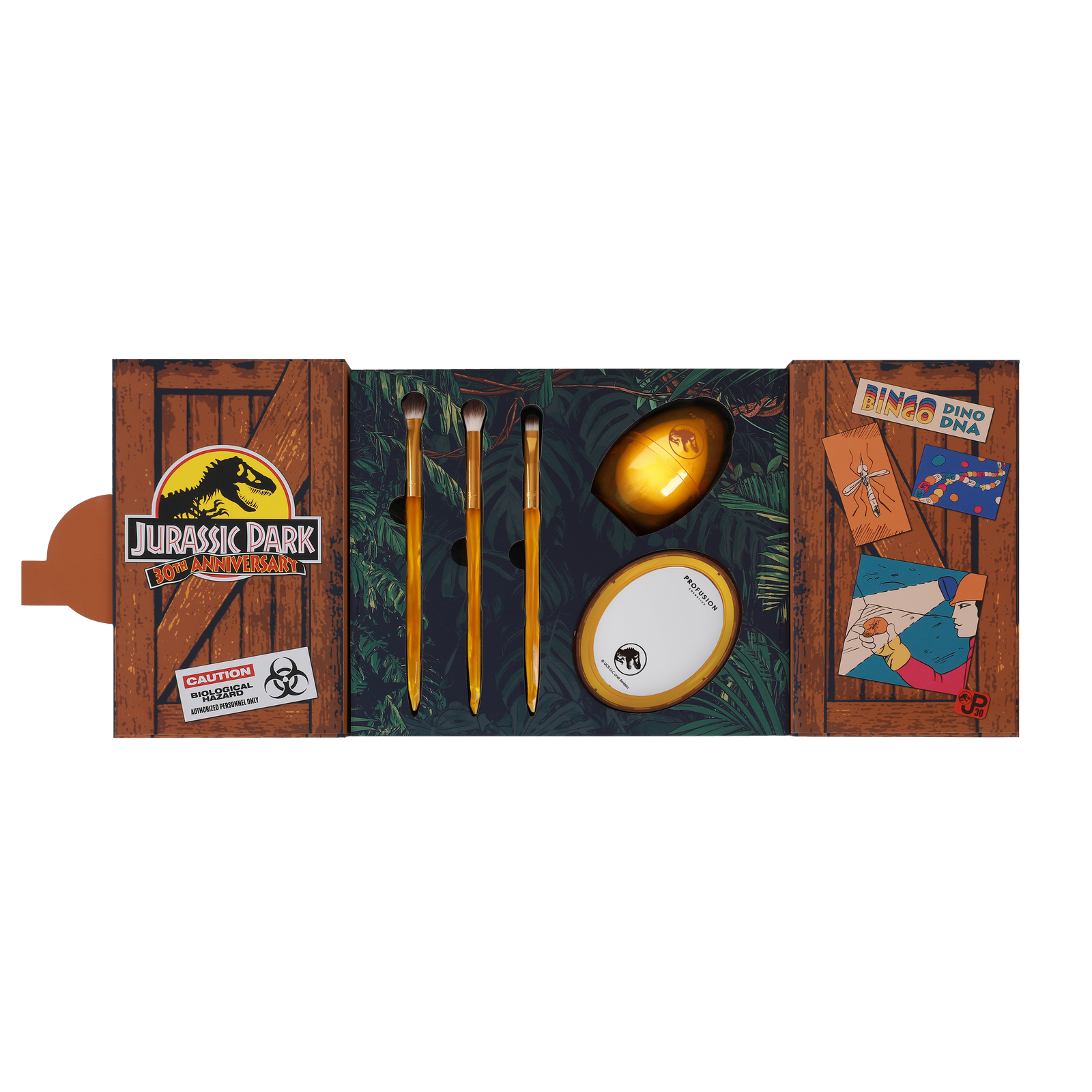 opened brush set with jurassic logo on left and three eyeshadow brushes and beauty blender and mirror in the middle , and on the right side different cartoon pictures one of a mosquito, a miner finding a mosquito in amber the words '' Bingo, Dino, DNA"